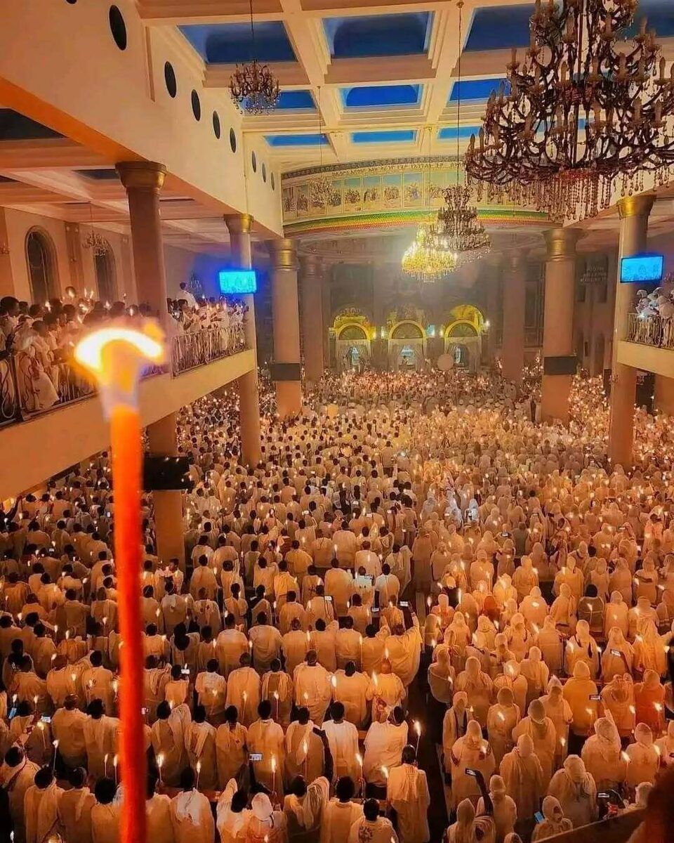 Fasika Paschal vigil with candle-lit worshippers filling the cathedral